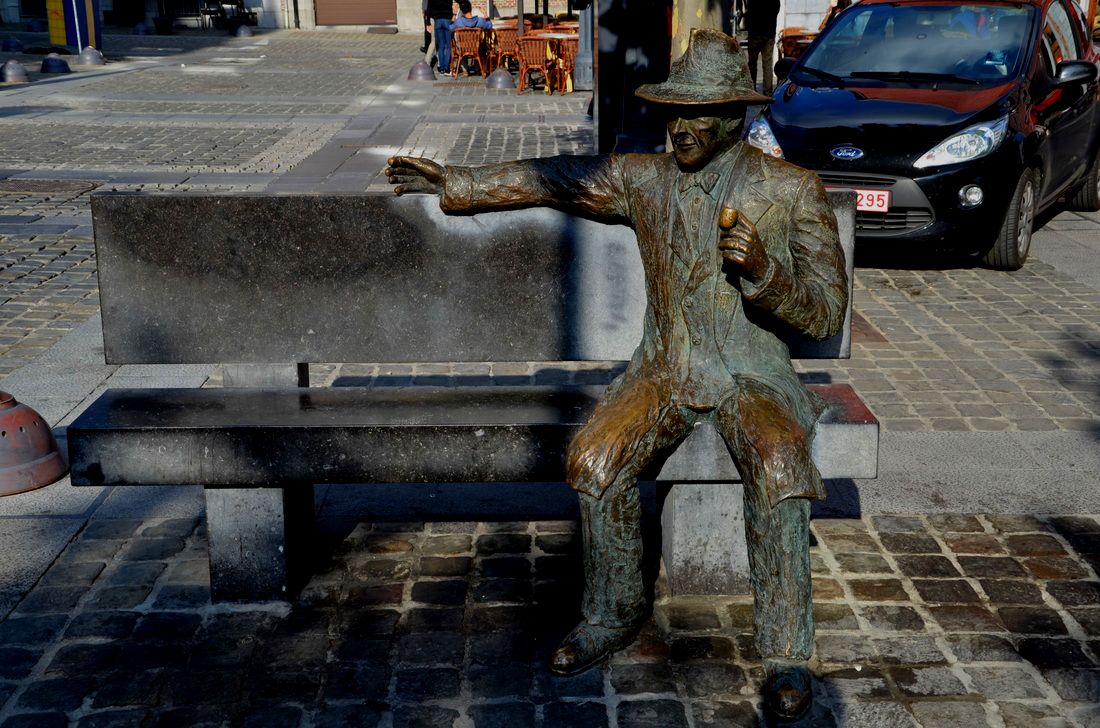 A monument in the form of a bench, on which sits the famous crime writer Georges Simenon. Liege, Belgium. 